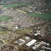 Oblique aerial view centred on the village, miners' rows and colliery, taken from the SW.