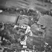 Oblique aerial view centred on the tower-house, school and garden, taken from the WSW.