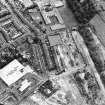 Oblique aerial view centred on the remains of the works, taken from the WNW.