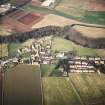 Oblique aerial view of Stenton centred on the church, burial-ground, old church and mausoleum, taken from the SE.