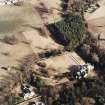 Oblique aerial view taken from the SW, centred on Wallhouse and a dovecot.