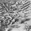 Oblique aerial view centred on the remains of the burial enclosures and village, taken from the S.