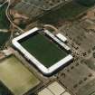 Oblique aerial view centred on the football stadium, taken from the NE.