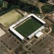 Oblique aerial view centred on the football stadium, taken from the NW.