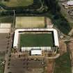 Oblique aerial view centred on the football stadium, taken from the W.