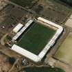 Oblique aerial view centred on the football stadium, taken from the SE.