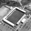 Oblique aerial view centred on the football stadium, taken from the NW.