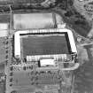 Oblique aerial view centred on the football stadium, taken from the W.