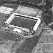 Oblique aerial view centred on the football stadium, taken from the WSW.