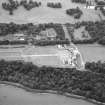 Oblique aerial view centred on the house, taken from the NNE.