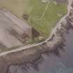 Hoy, Crockness, oblique aerial view, taken from the ESE, centred on the Martello Tower. A curving linear soilmark is visible in the centre left of the photograph.