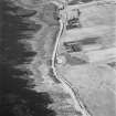 Hoy, Crockness, oblique aerial view, taken from the NNW, centred on the Martello Tower. A curving linear soilmark is visible in the centre right of the photograph.