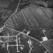Hoy, Ore Farm, oblique aerial view, taken from the SSW, centred on the ammunition storage huts.