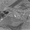 Oblique aerial view from N.  Visible is part of a Mainhill type hangar, a hangar base and two protected dispersal bays.