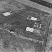 Oblique aerial view from E.  Visible are the concrete bases for four hangars to the E of the main NE-SW runway.