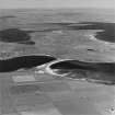 Oblique aerial view of Orkney, South Ronaldsay, Burray and South Ronaldsay, Churchill Barrier No.4 with the village of Burray taken from the S. The view N also shows the Churchill Barriers Nos.1, 2 and 3 with Lamb Holm and Glimps Holm.