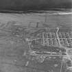 Oblique aerial view  of Orkney, Flotta, Golta, of a 'Z' battery of unrotating fixed projectile launchers with ammunition huts, the hut bases of the accommodation camp, cable trenches and several other structures. Taken from NNE.