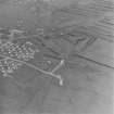 Oblique aerial view of Orkney, Flotta, Golta, of part of the 'Z' battery of unrotating fixed projectile launchers with ammunition huts.  The bases of several other structures are also visible. Taken from the SW.