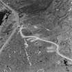 Oblique aerial view of Orkney, Hoy, taken from the S, of concrete hut bases of the accommodation camp for Lyrawa Hill heavy anti aircraft battery.  Also visible is a pillbox.