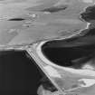 Oblique aerial view of Orkney, South Ronaldsay, Burray and South Ronaldsay, Churchill Barrier No.4 and the blockship, steamship Collingdoc taken from the SW.