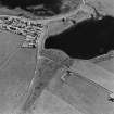 Aerial view of broch at Loch of Ayre and part of the village of St Mary's, from NNW.