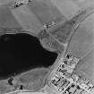 Aerial view of broch at Loch of Ayre and part of the village of St Mary's, from SSE.