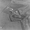 Oblique aerial view of the Second World War Ness Battery, taken from the S.  Visible are the two gun-emplacements, battery observation post, and extant crew accommodation camp.