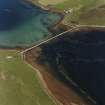 Oblique aerial view of Orkney, Burray, Hunda, Hunda Reef barrier taken from the WNW.