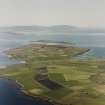 Oblique aerial view of Orkney, Burray, general view taken from the E of Burray, Burray village, Hunda Island with Scapa Flow and Hoy in the background. Also visible is St Lawrence's Church at Southtown