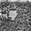 Oblique aerial photograph centred on the house, taken from the W.