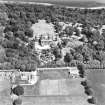 Oblique aerial photograph centred on the house, taken from the W.