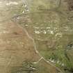 Oblique aerial view of Totamore centred on cottages, a farmsteading, the remains of a farmstead and a general view of Clabhach, taken from the SW.