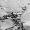 Oblique aerial view centred on the farmhouse and the farmstead, taken from the NNW.