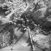 Oblique aerial view centred on the farmstead with the remains of the observation post adjacent, taken from the N.