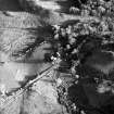 Oblique aerial view centred on the farmstead with the remains of the observation post adjacent, taken from the WNW.