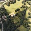 Oblique aerial view centred on the country house and gardens, taken from the E.