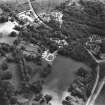 Oblique aerial view centred on the country house and gardens, taken from the NW.