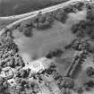 Oblique aerial view centred on the country house and gardens, taken from the E.