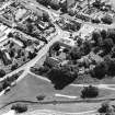 Oblique aerial view of Biggar centred on Moat Park Church, taken from the NW.