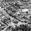 Oblique aerial view of Biggar High Street centred on the church hall, taken from the NW.