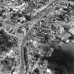 Oblique aerial view of Biggar High Street centred on the church hall, taken from the SW.