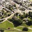 Oblique aerial view of Biggar centred on Moat Park Church, taken from the NW.