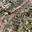 Oblique aerial view of Biggar High Street centred on the church hall, taken from the NW.