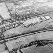 Oblique aerial view of Castlecary centred on the Forth and Clyde canal, taken from the NNE.
