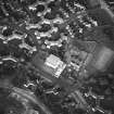 Oblique aerial view of Cumbernauld centred on sacred Heart Roman Catholic Church with the Sacred Heart Roman Catholic Primary School adjacent, taken from the W and recorded as part of the World of Worship project.