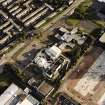 Oblique aerial view of Cumbernauld centred on the Central Health Centre with the Bron Way Council Offices and Community Centre adjacent, taken from the NNE and recorded to complement a Threatened Building Survey.