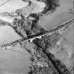 Oblique aerial view centred on the railway viaduct, taken from the W.