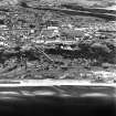 Ardeer, Nobel's Explosives Factory, oblique aerial view, centred on cartridging plant, with the remains of the nitro-glycerine hills behind