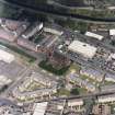 Oblique aerial view centred on Saint Columba's Roman Catholic Church. The Forth and Clyde canal is visible in the top half of the photograph.