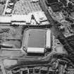 Oblique aerial view centred on the football stadium, taken from the NW.